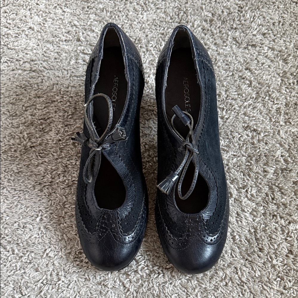 AEROSOLES Navy low heels with lace up design.